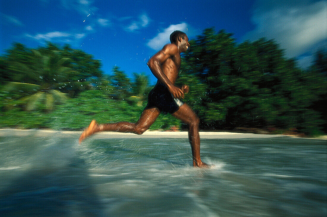 Beach runner, Anse Lazio, Praslin, Seychelles