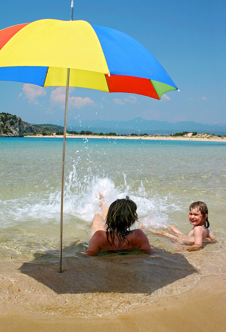 Woman with daughter on the beach, Voidokilia Bay, Peloponnese, Greece