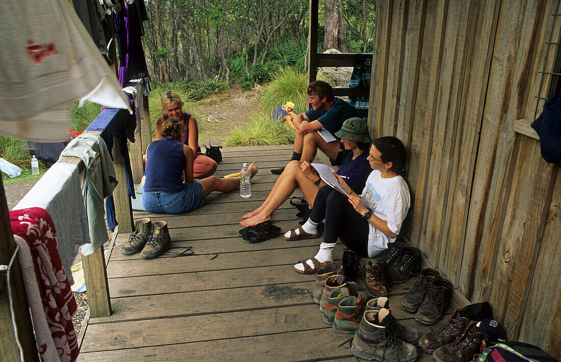 Hikers hut, Overland Track, Cradle Mountain NP, Australia, Tasmania, walkers resting at the Kiora Falls hut on the Overland Track in Cradle Mountain National Park