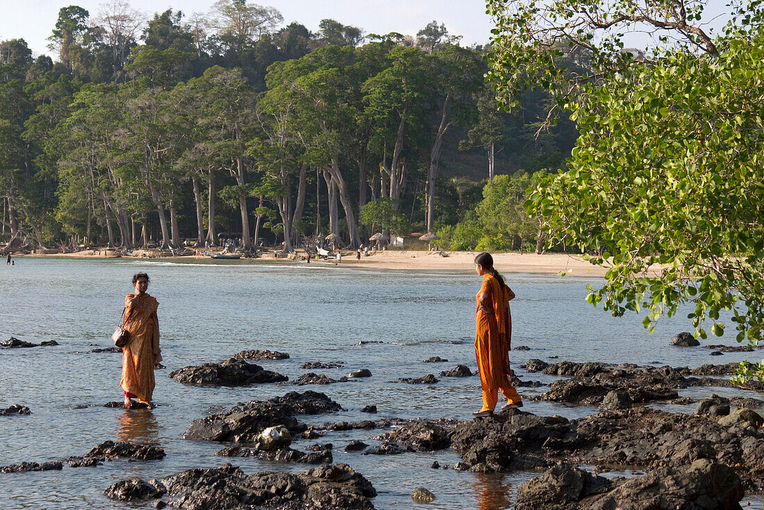 Two Indian women bathing in the water, Chiriya Tapu beach, South Andaman, Andaman Islands, India