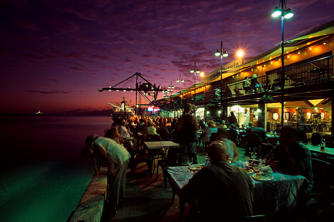 Stokes Hill Wharf with street cafe in the evening, Darwin, Northern Territory, Australia