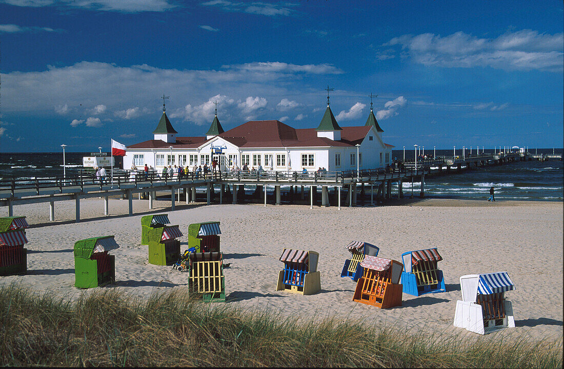 Beach chairs at a sandy beach with the sea bridge, Ahlbeck, Usedom, Mecklenburg-Vorpommern, Germany