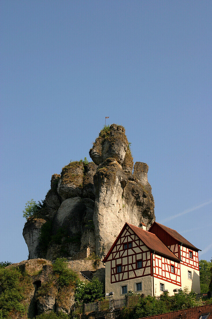 Half timbered houses and rock in the sunlight, Tuechersfeld, Franconian Switzerland, Bavaria, Germany, Europe