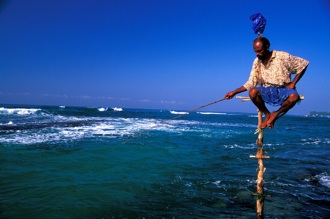 Stilt fisherman with fishing rod, Sri Lanka, Asia