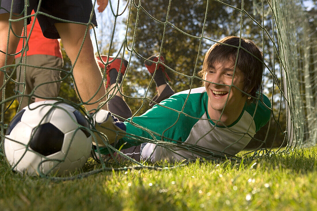 Young men playing soccer