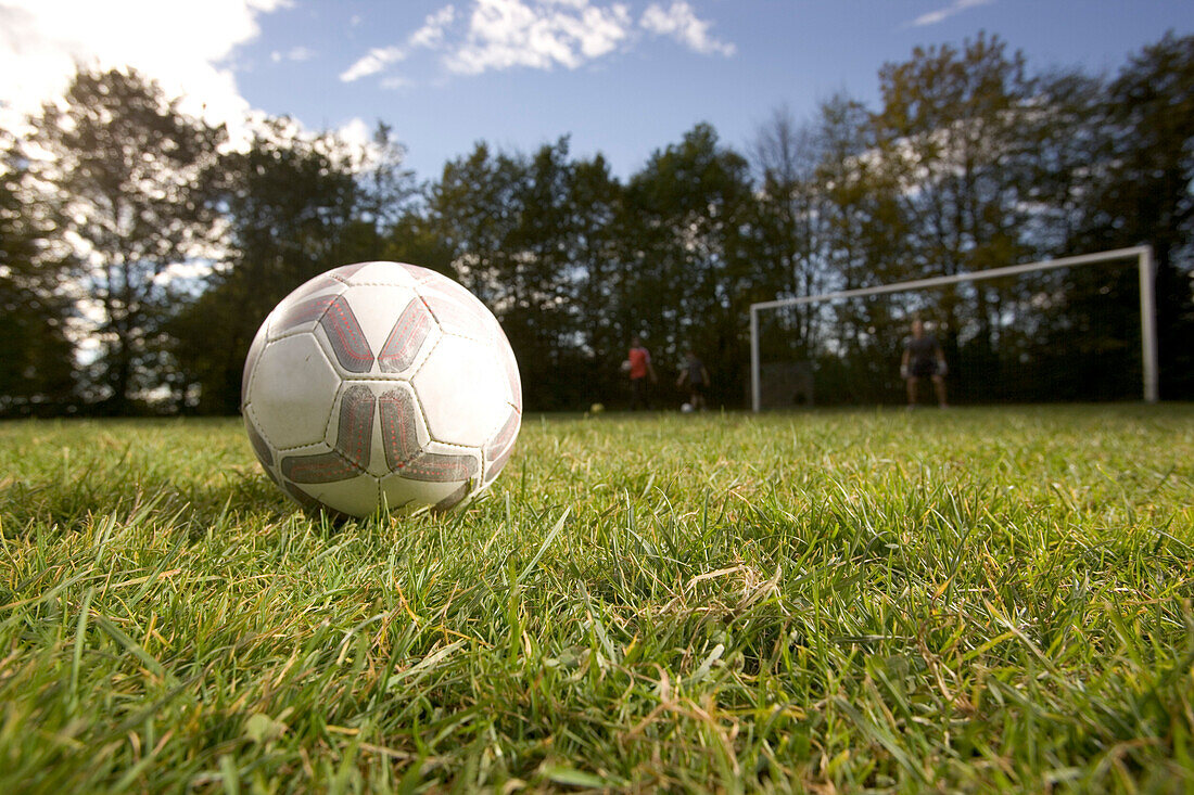 Soccer ball lying on playing field