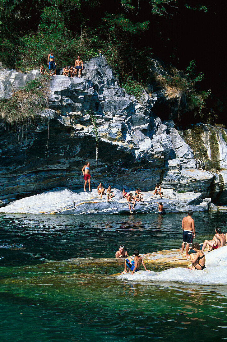 People enjoying a bath in the river, Valle di Maggia, Ticino, Switzerland