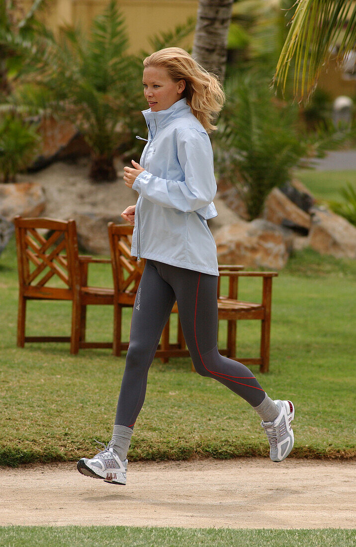 A woman jogging, running on Mauritius, Fitness