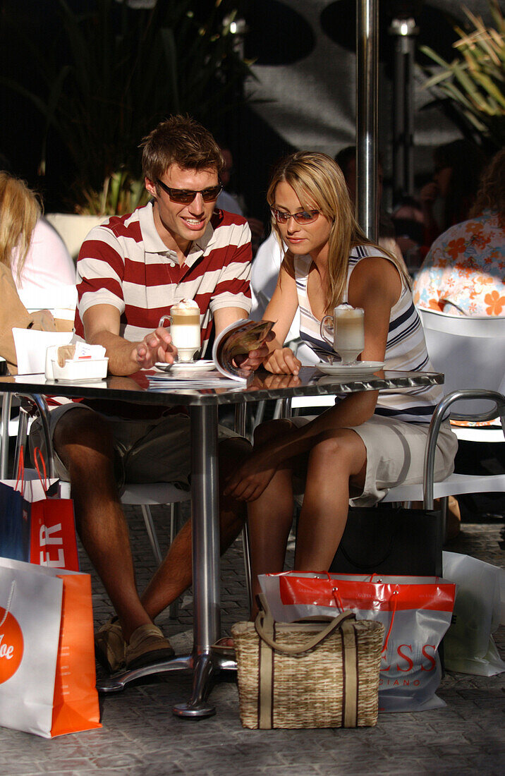 Couple drinking Latte Macchiato in a cafe, shopping break, Cape Town, South Africa