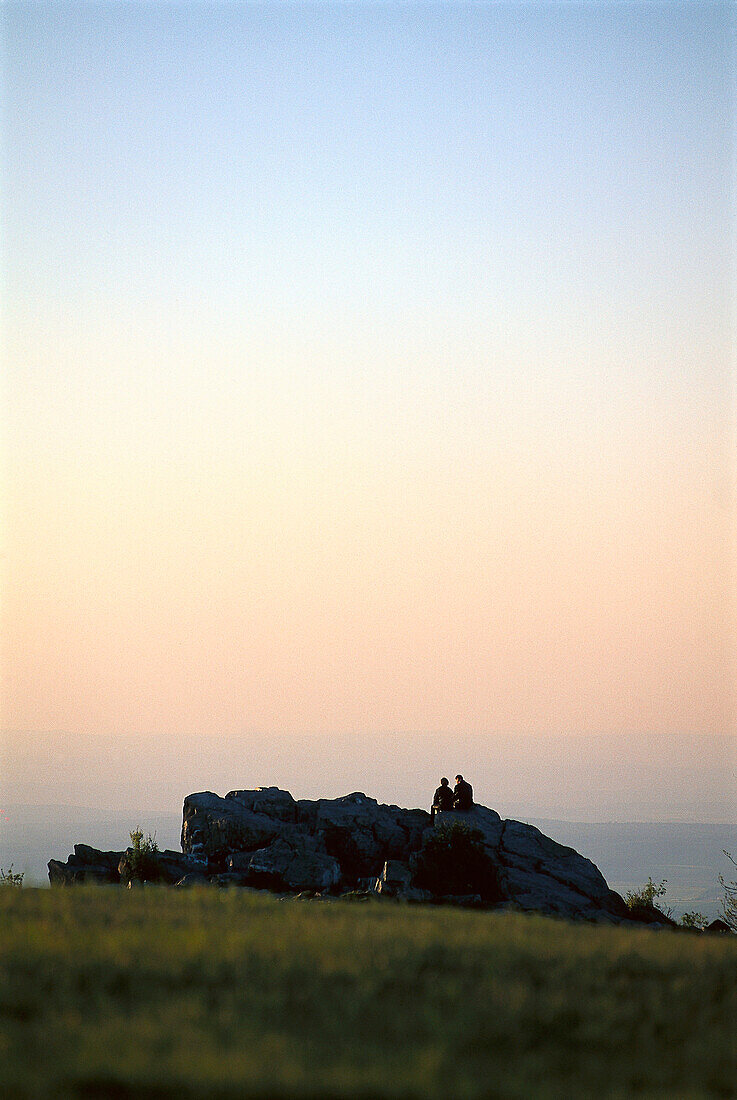 People on Feldberg at Taunus mountains at sunset, Hesse, Germany, Europe