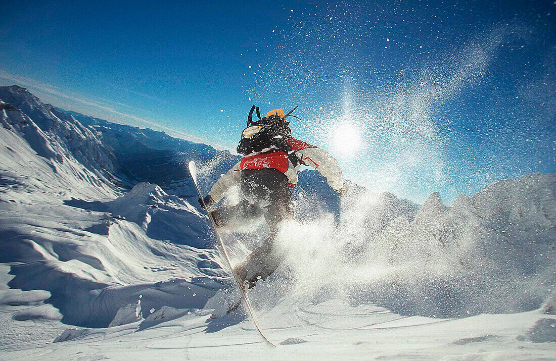 Snowboarder jumping, mount Valluga, Arlberg, Tyrol, Austria