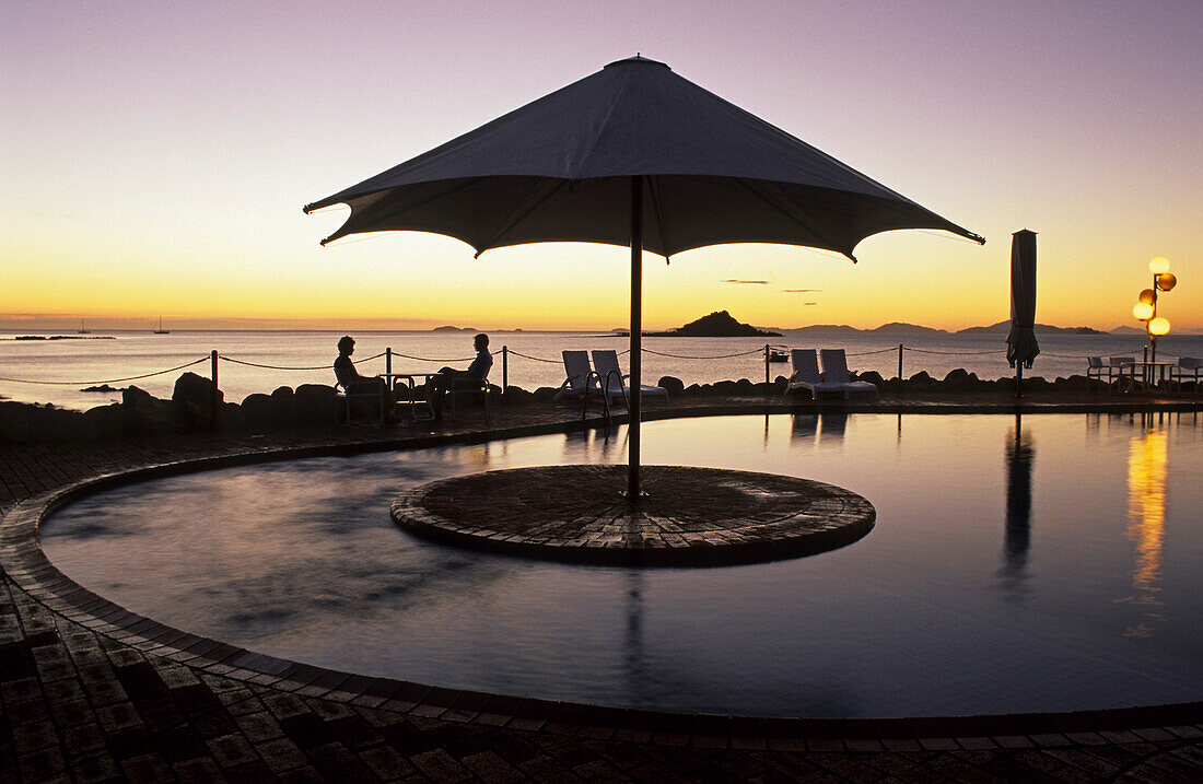 Sunset at pool, Brampton holiday Island resort, Brampton Island, Great Barrier Reef, Queensland, Australia