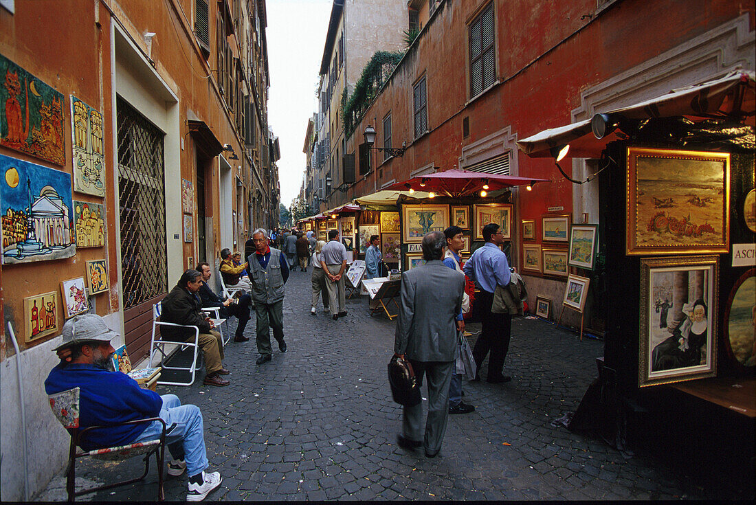 People looking at pictures in an alley, Via Margutta, Rome, Latio, Italy, Europe