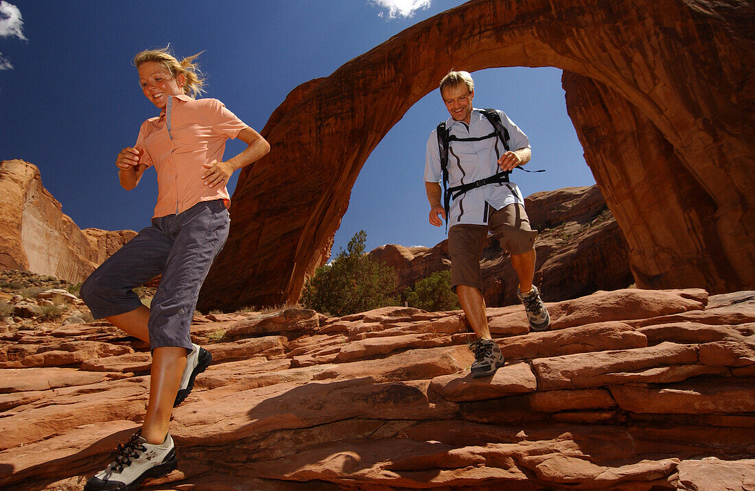 Couple hiking near Rainbow Bridge, Arizona, USA