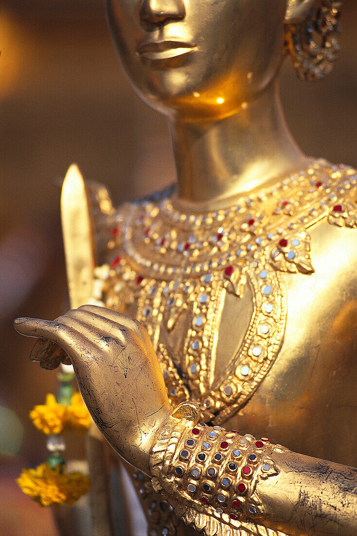 Detail of a golden statue at the temple Grand Palace, Bangkok, Thailand