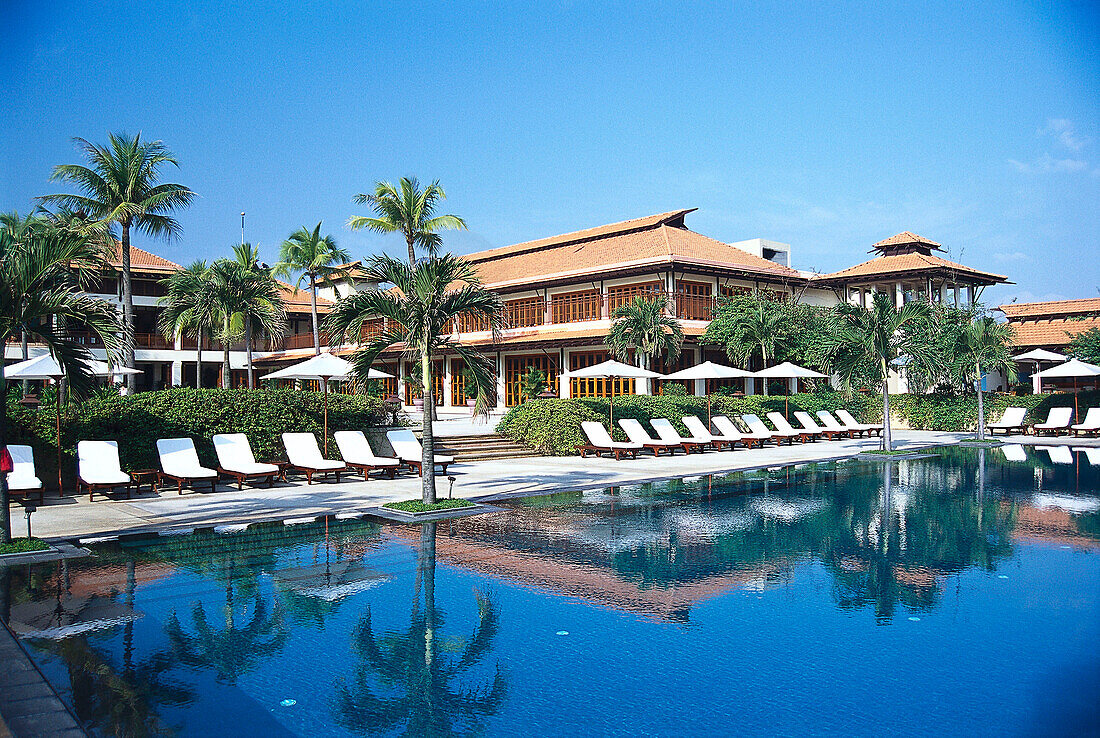 Hotel and pool under blue sky, Furama Resort, Danang, Vietnam, Asia