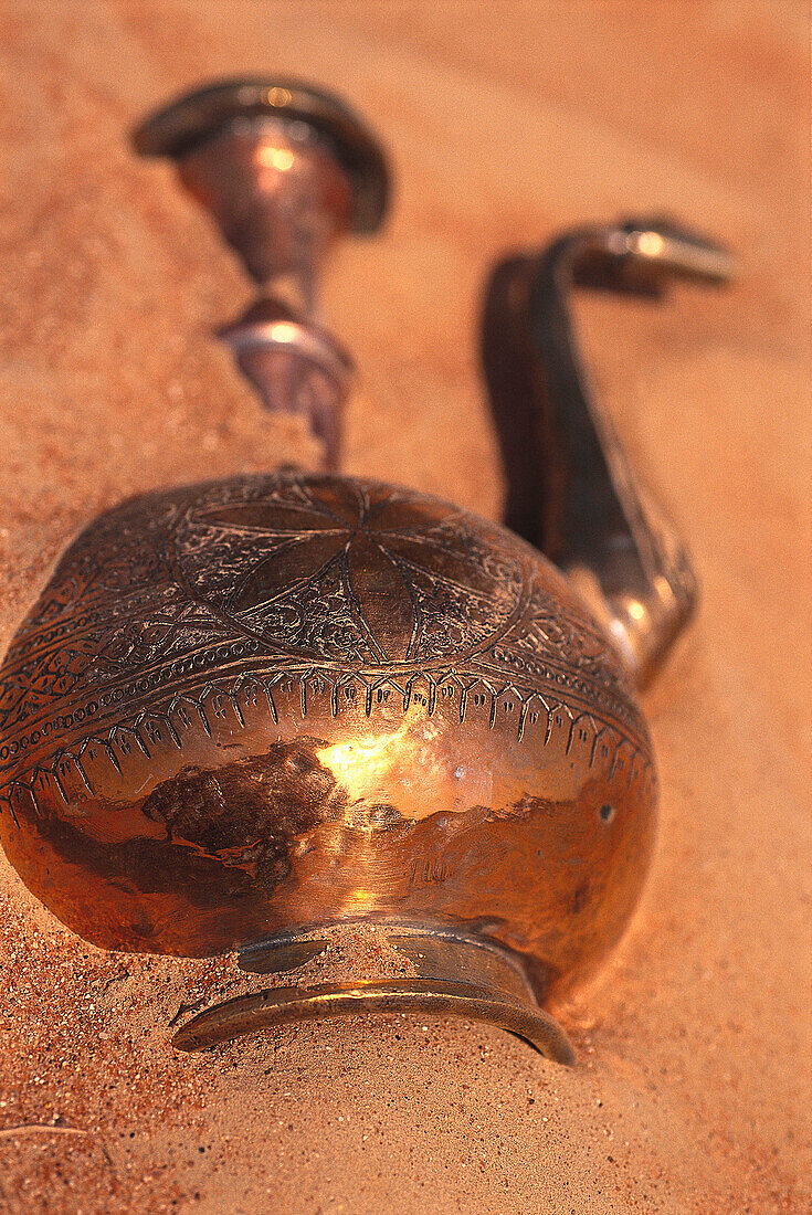 Copper jug in the sand of the desert, Dubai, V.A.E., United Arab Emirates, Middle East, Asia