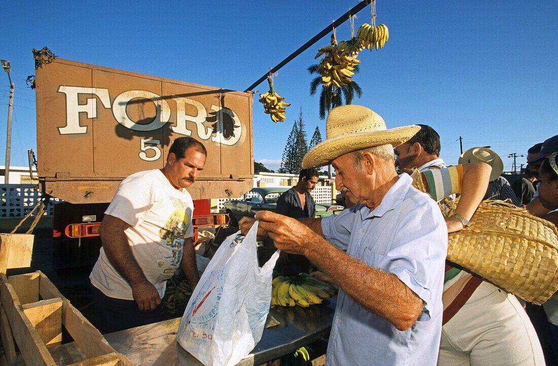 banana seller at a market, Trinidad, Cuba