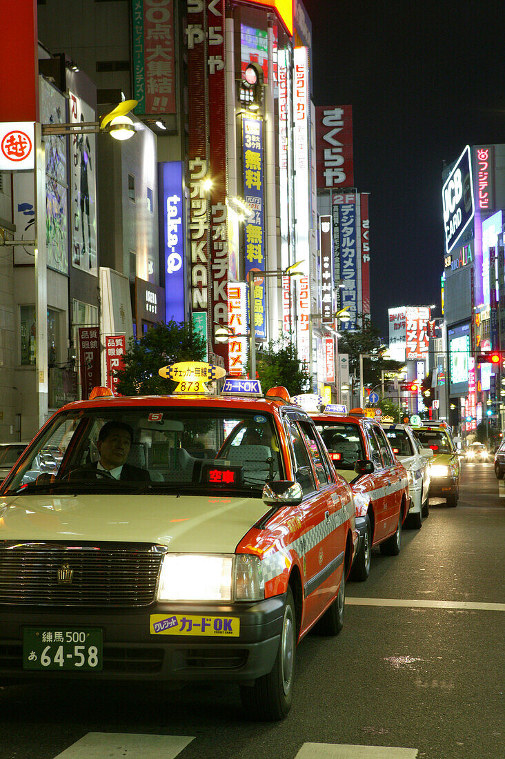 Taxis in Yasukoni Dori, Shinjuku Tokyo City, Japan