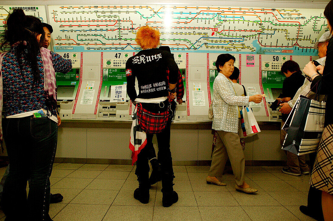Punk in front of ticket machine, Subway station in Shinjuku Tokyo, Japan