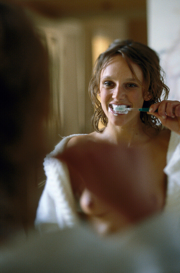 Woman brushing teeth