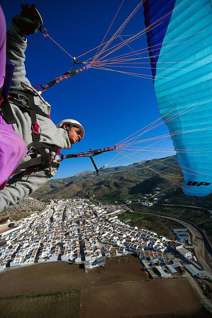 Paraglider above the town of Malaga, Andalusia, Spain, Europe