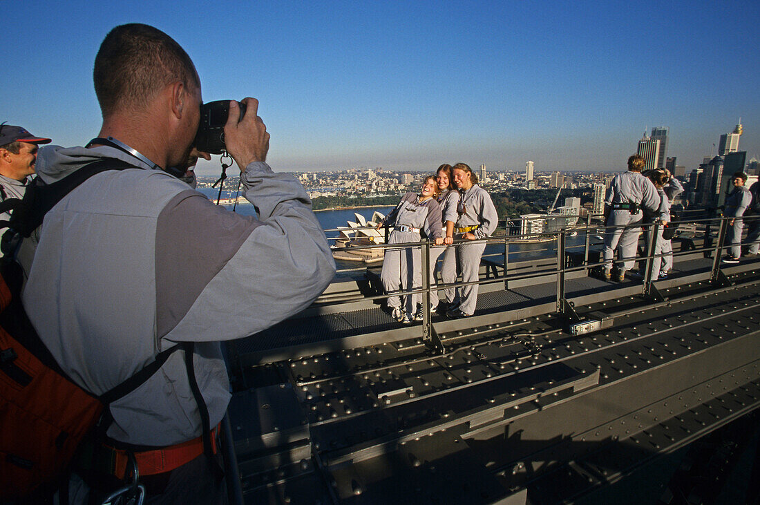 One man making foto of women, Harbour Bridge Tour, Harbour Bridge, Sydney, Sydney Harbour, New South Wales, Australia