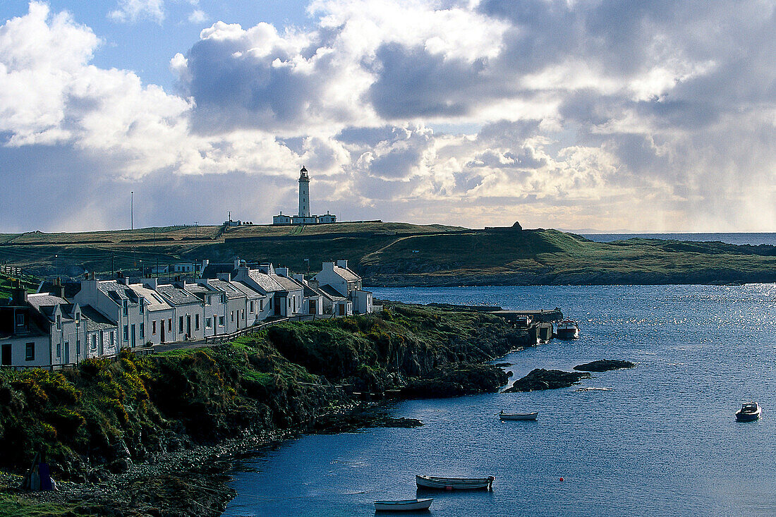 View across Portnahaven towards the lighthouse, Islay, Inner Hebrides, Scotland, Great Britain