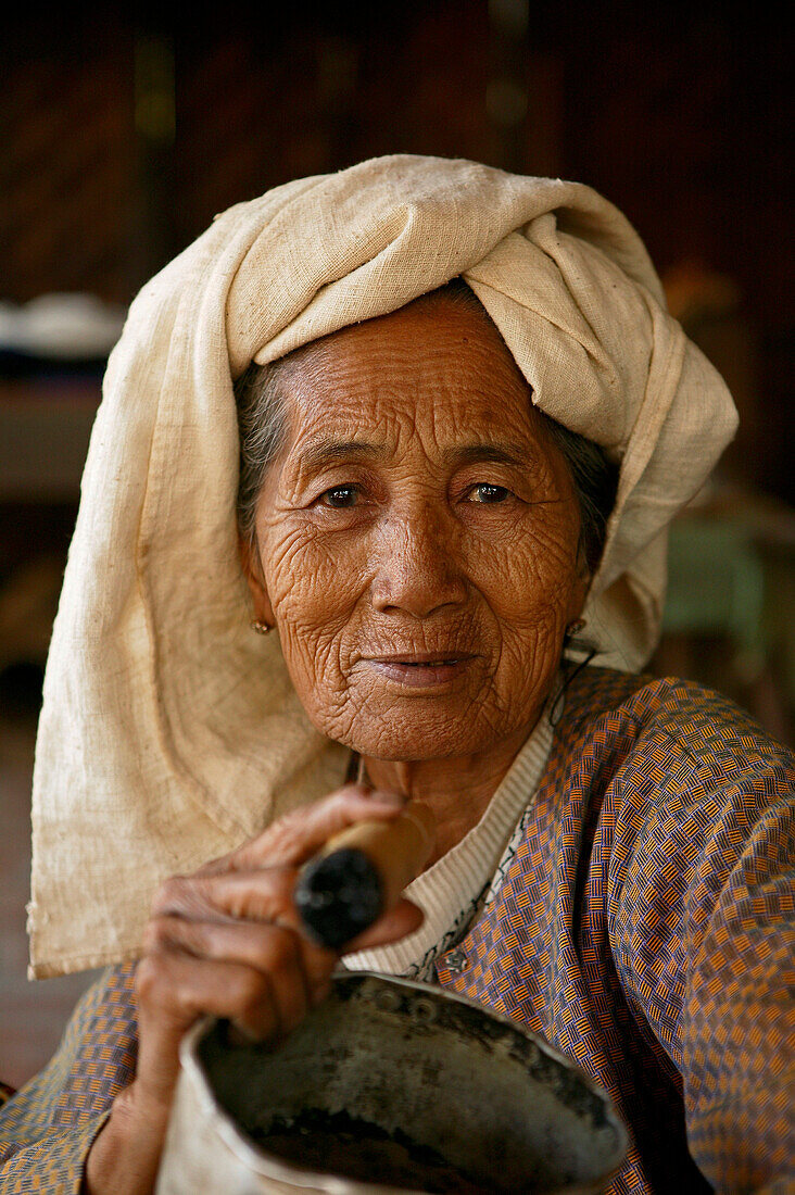 portrait of eldery woman smoking cheerot cigar , Burma, Myanmar