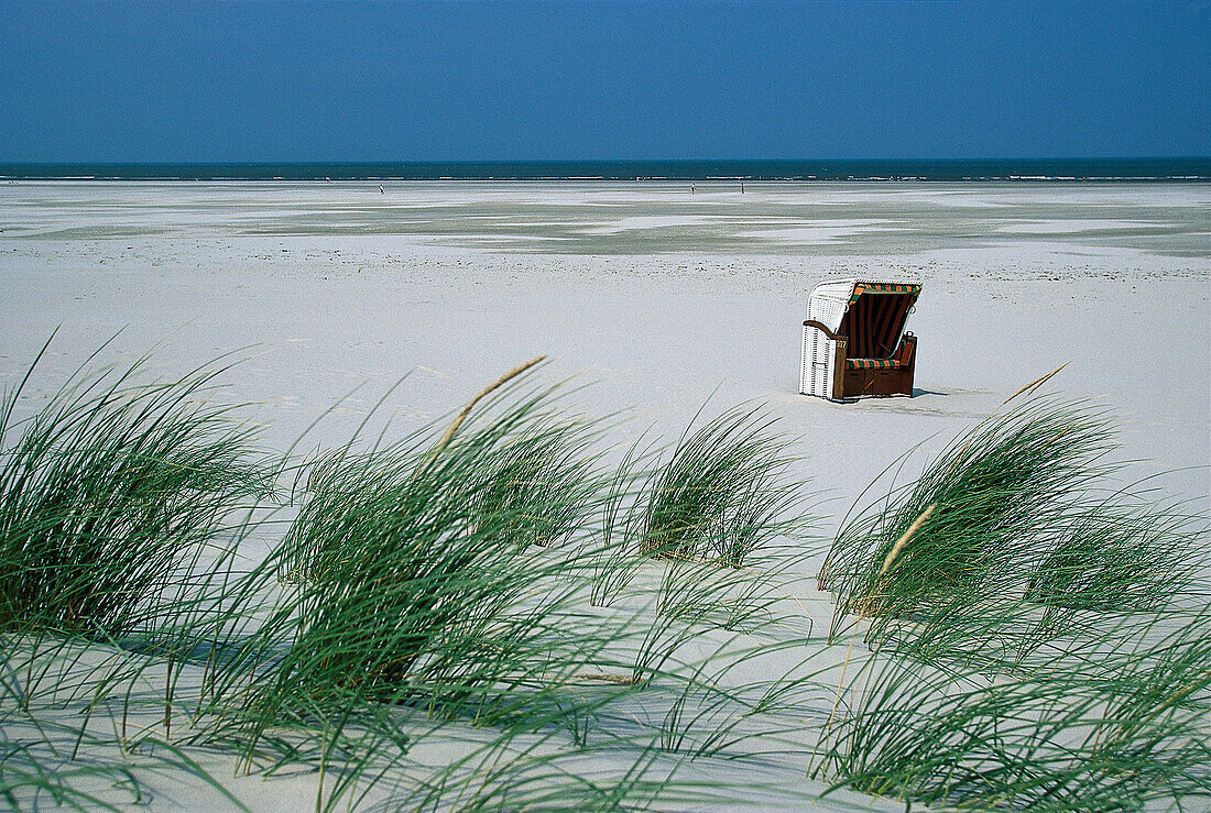 Beach chair at the beach and dunes, Juist, East Frisian Islands, East Frisia, Lower Saxony, Germany