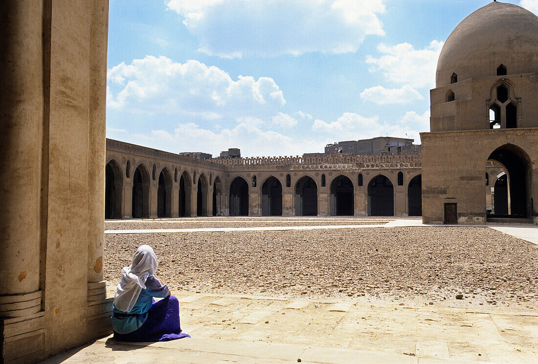Woman in front of Ibn Talun Mosque, Cairo, Egypt
