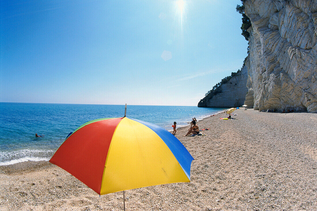 People sunbathing on the beach, Spiaggia Vignanotica, Baia dei Gabbani, Gargano, Puglia, Italy