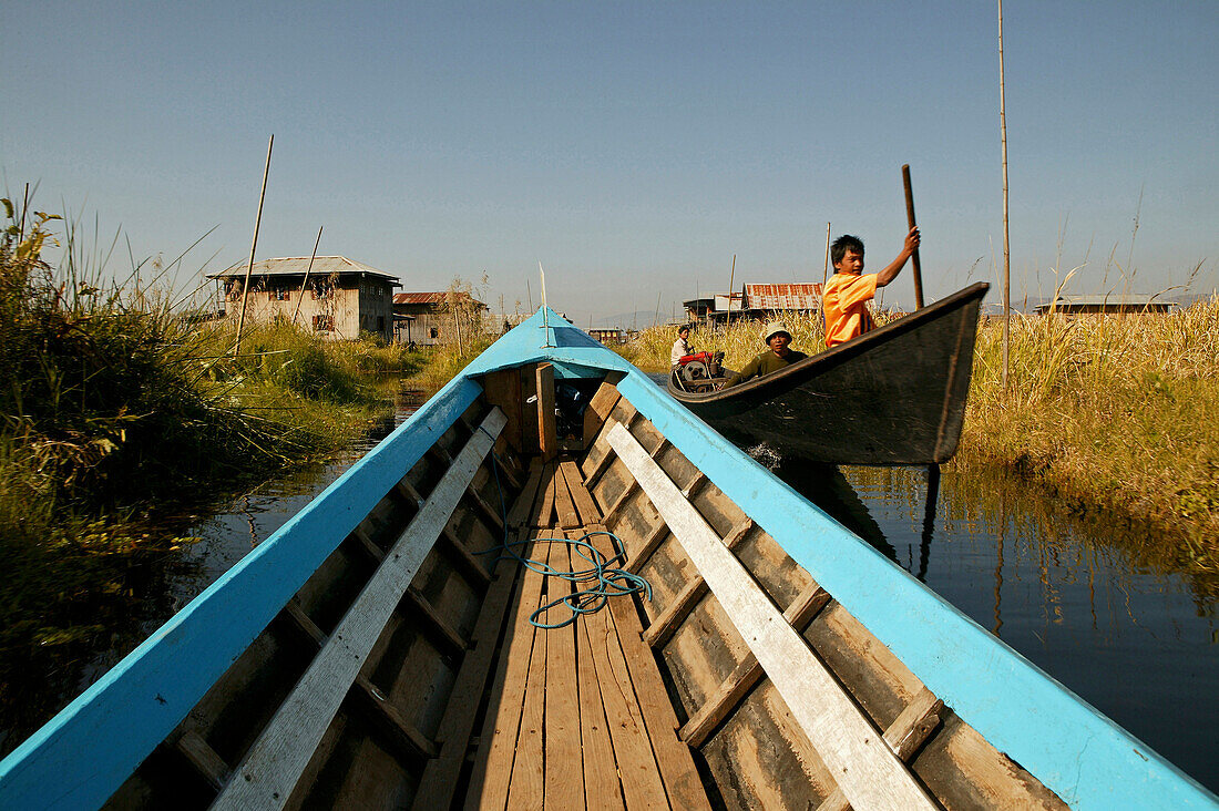 Longboat, village on stilts, Inle Lake, Myanmar