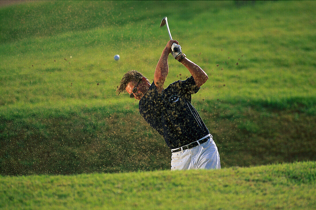 Golfer in bunker, Soma Bay, Egypt