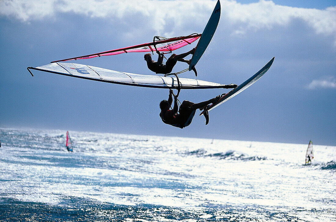 Sailboarders during a jump, Hookipa, Maui, Hawaii, USA, America
