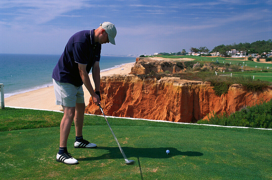 Man hitting golf ball, Vale do Lobo Algarve, Portugal