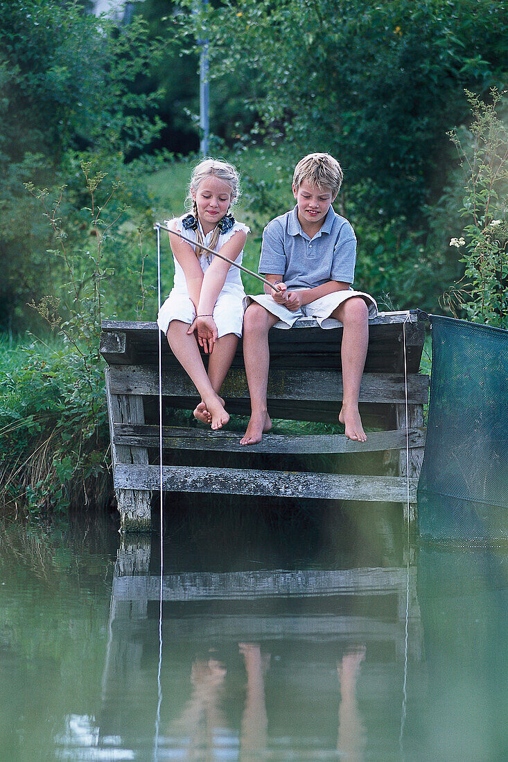 Gil and boy fishing at lake