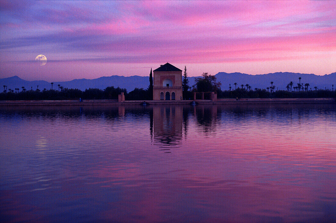 Moonrise above La Ménara pavillion, Marrakech, Morocco, Africa