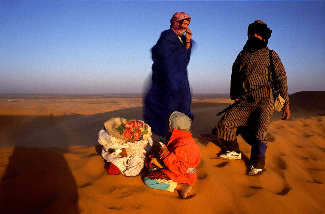 Touaregs in sandstorm, Erg Chebbi dunes, Sahara de, Merzouga, Sahara Morocco, North Africa