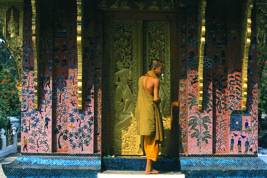 Wat Xieng Thong, monk at small temple, Luang Prabang, Laos Indochina, Asia