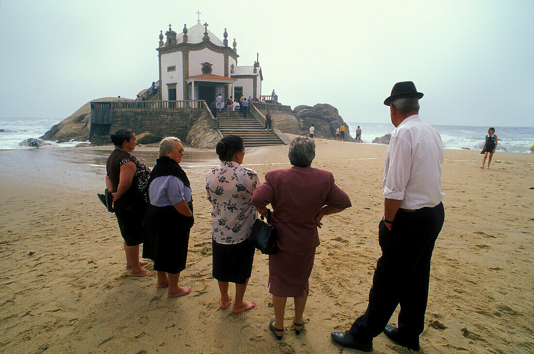 Pilgrims in front of Pilgrim Chapel Senhor da Pedra, Miramar near Porto, Portugal