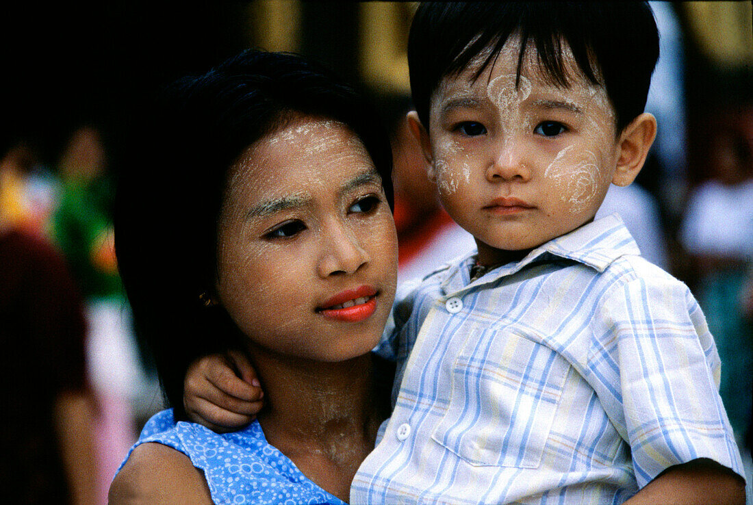 Mother and boy with Thanaka make up, , Rangoon, Myanmar Asia