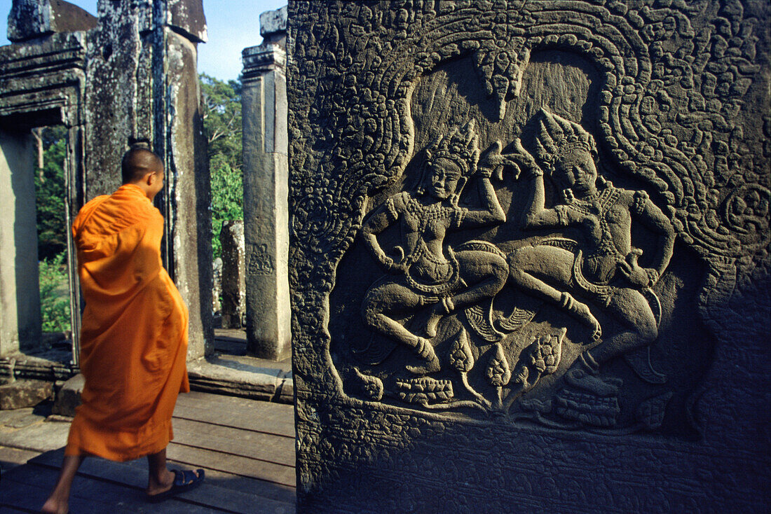 Monk in Bayon temple, Angkor, Siem Raep Cambodia, Asia