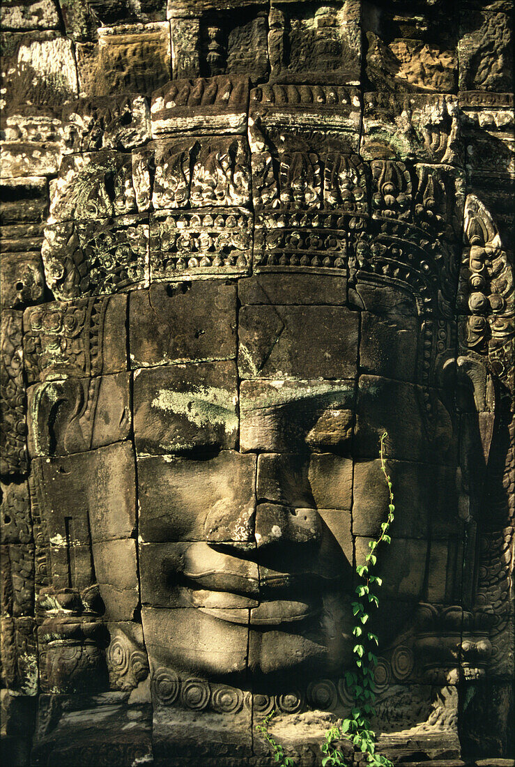 Buddha face, carved into stone, Bayon temple, Angkor, Siem Raep, Cambodia, Asia