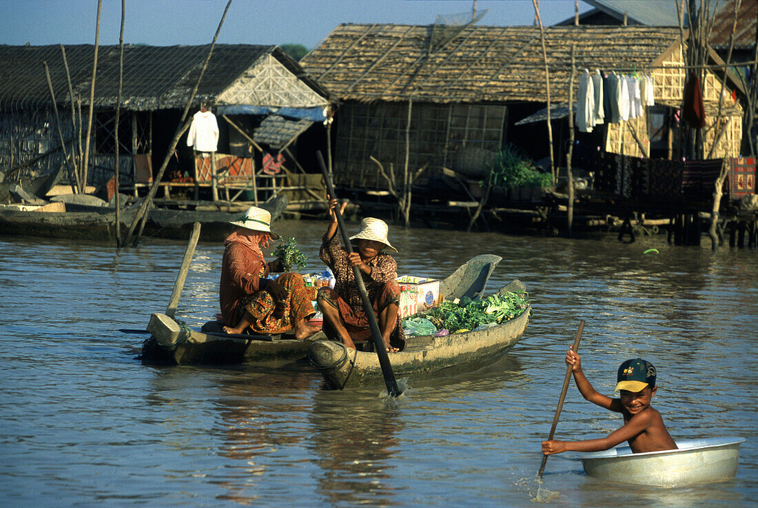 People in boats on Tonle Sap lake, Siem Raep province, Cambodia, Asia