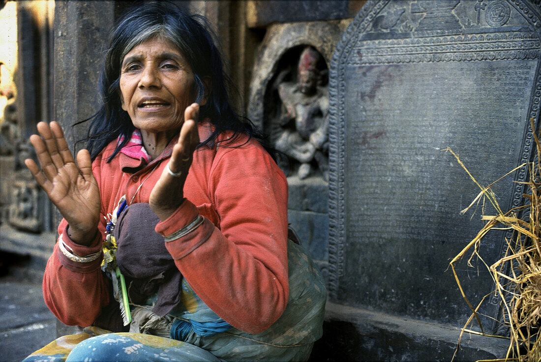 Woman in a Kathmandu temple, Kathmandu, Nepal Asia