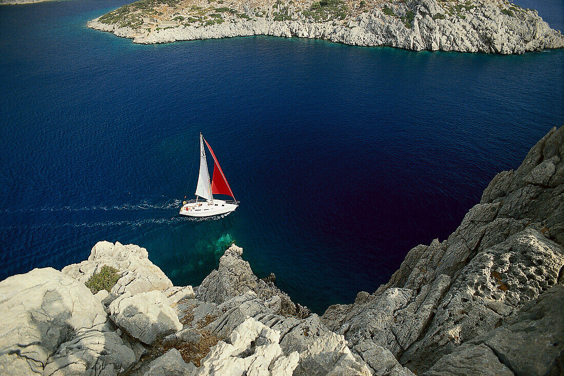 Sailing boat off a steep coast, Turkish Aegean, Turkey, Europe