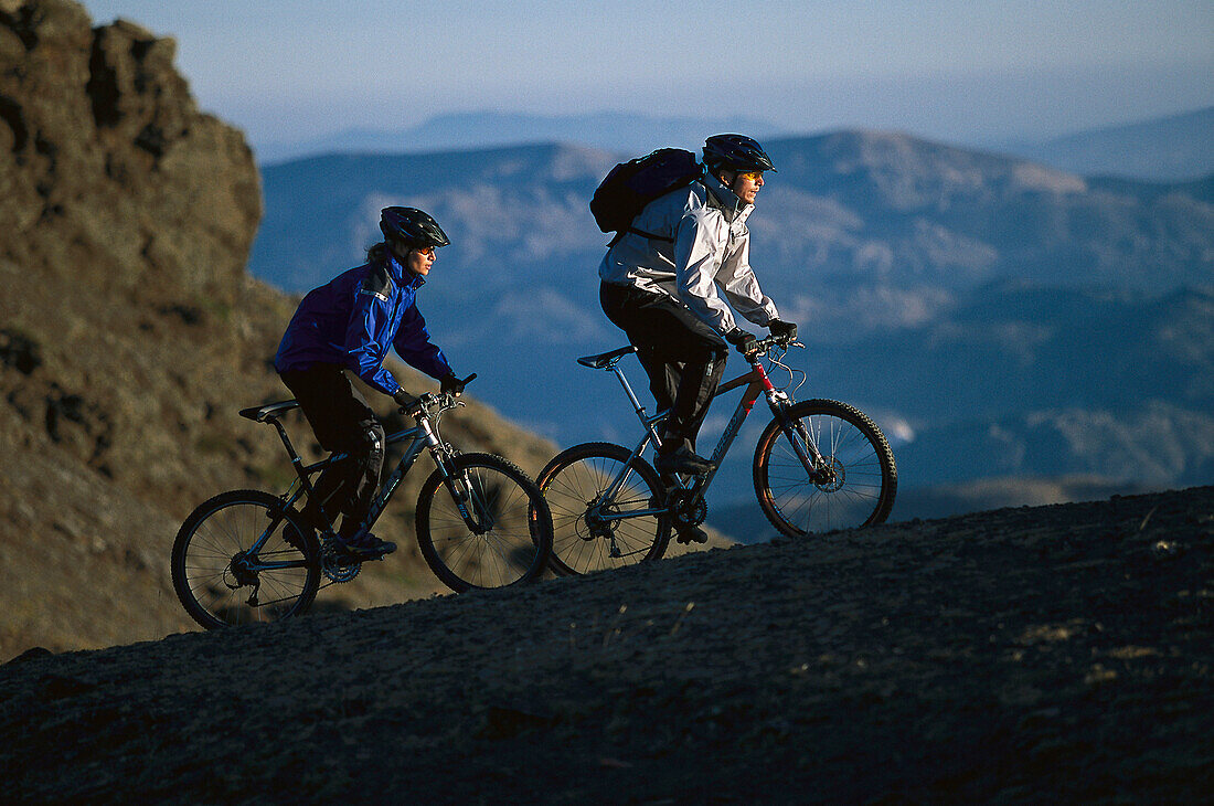Two mountain bikers in the mountains, Andalusia, Spain, Europe