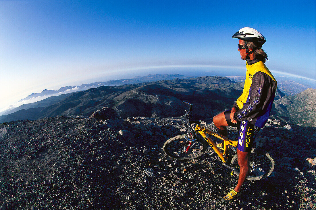 Mountain biker admiring the view, MTB tour, Skinakas, Crete, Greece