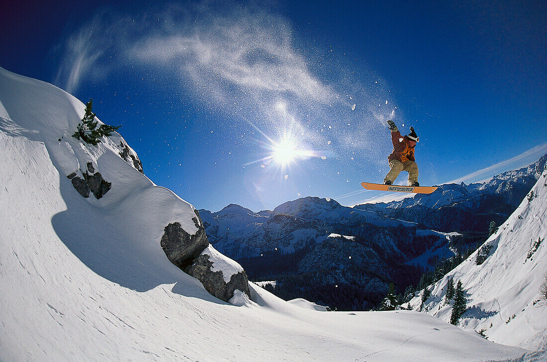 Snowboarder jumping, Arlberg, Vorarlberg, Austria